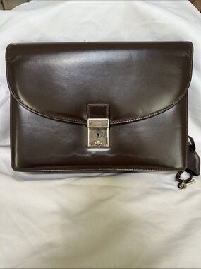 Gucci Dark Brown Leather wristlet with Silver-Tone Lock Strap and Key
